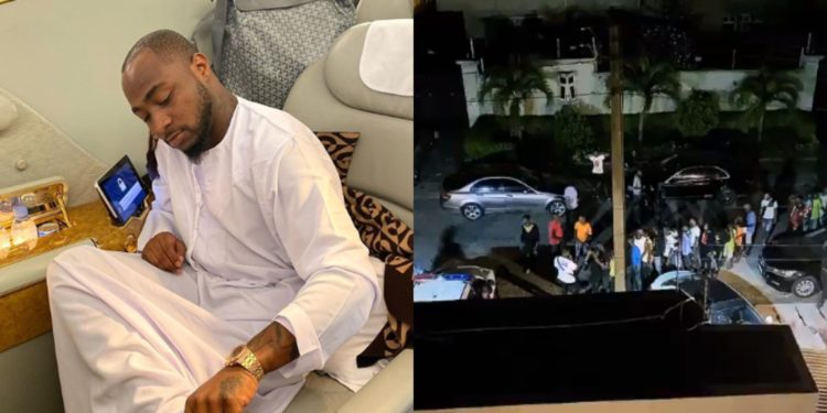Davido Distributes Money To Crowd In Front Of His Lekki mansion; Tells Them To Come Back For More (Video)