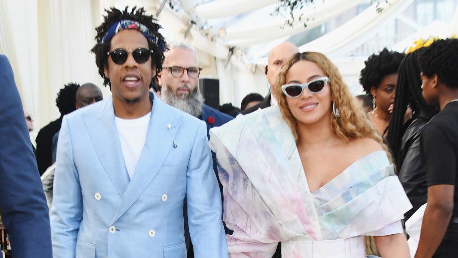 Video: Jay Z, Beyonce Sit During National Anthem At Super Bowl