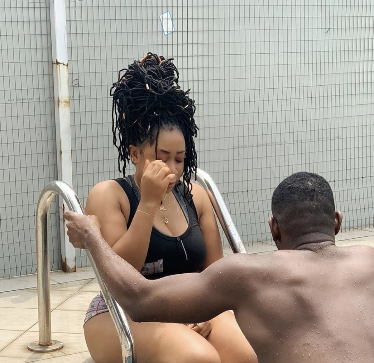 Moyo Lawal Dives Into Swimming Pool With Fitness Trainer (Video)