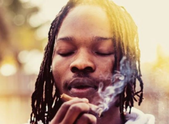 Lady Gets Naira Marley Tattoo On Her Body (Photo)