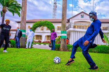 Governor Jide Sanwo-olu pictured playing football with Barcelona player, Asisat Ishoala